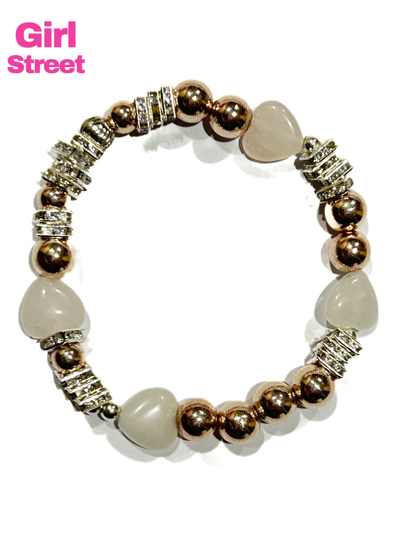 Heart bracelet it’s a a stylish Jeans Bracelet with rose quartz hearts and square spacer beads with golden balls